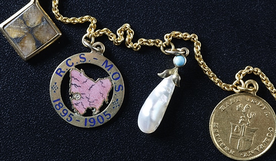 Assembled by Marion Oak Sticht (1864-1924), Necklace and charm pendants, c. 1900-1914.  Purchased with the assistance of the TMAG Foundation Ltd. 2018, Tasmanian Museum and Art Gallery